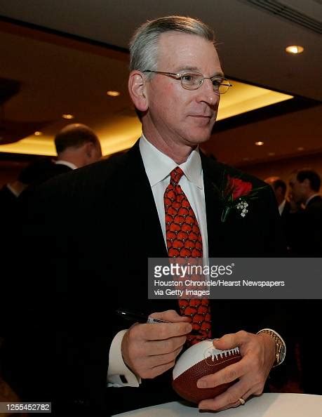 Auburn Tigers head football coach Tommy Tuberville autographs a mini ...