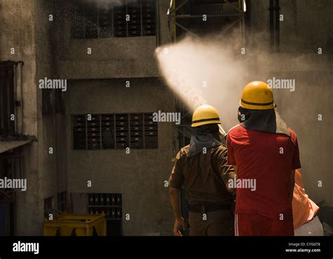 Firefighters During A Rescue Operation Gurgaon Haryana India Stock