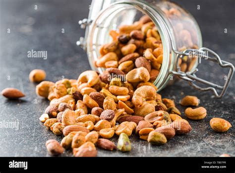 Spicy Flavoured Nuts Mix Of Nuts In Jar Stock Photo Alamy