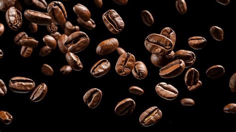 Premium Ai Image Falling Roasted Coffee Beans Chaotic Motion On Black