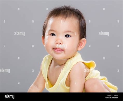 Baby girl make funny face Stock Photo - Alamy