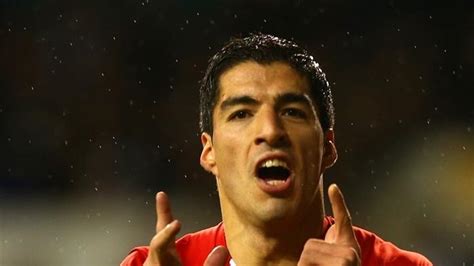 In form Suárez signs on for more with Liverpool UEFA