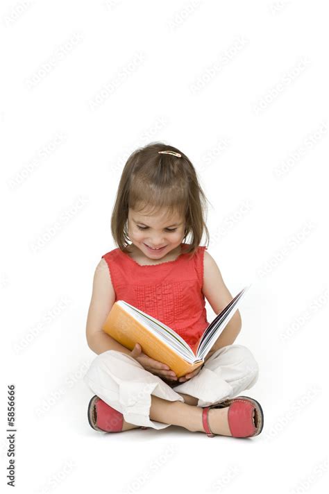 little girl reading a book Stock Photo | Adobe Stock