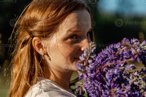 Close Up Portrait Of Young Beautiful Redhead Woman With Freckles