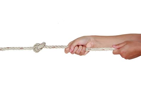 Premium Photo Cropped Hands Pulling Rope Against White Background