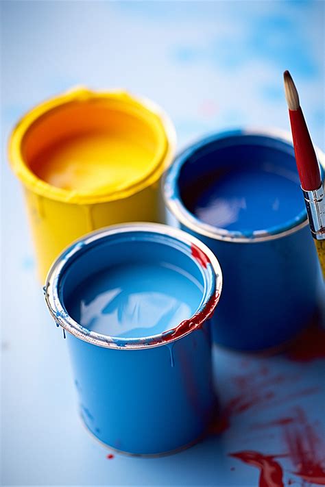 Three Paint Pots Painted In Different Colors Background Wallpaper Image