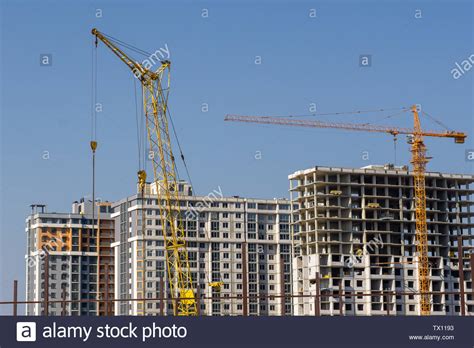 Construction Crane And High Rise Building Under Construction Stock