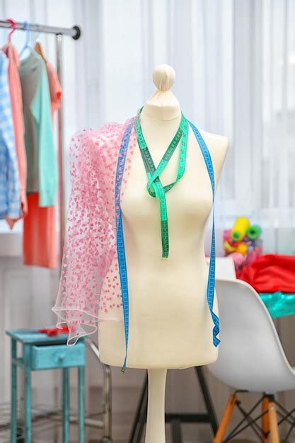 Premium Photo Tailor Dummy With Measuring Tapes In Fashion Studio