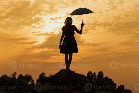 Silhouette sad girl at sunset. 13321361 Stock Photo at Vecteezy