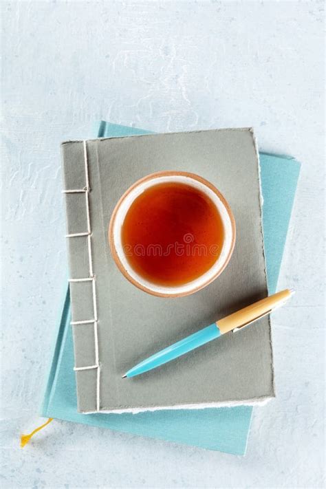 A Diary Journals With A Pen And A Cup Of Tea Minimalist Style Top