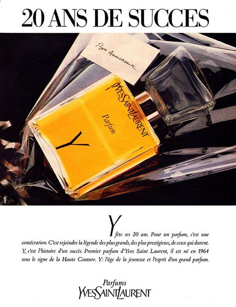 An Advertisement For The Perfume Brand Y With Its Yellow Bottle And