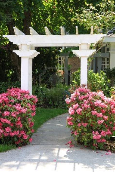 Pretty garden arbor with pink flowers | Express Photos