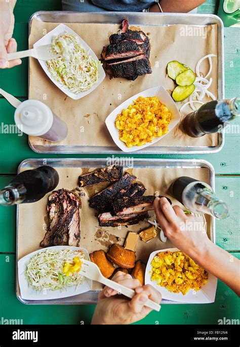 Friends Eating Barbecue Food Stock Photo Alamy