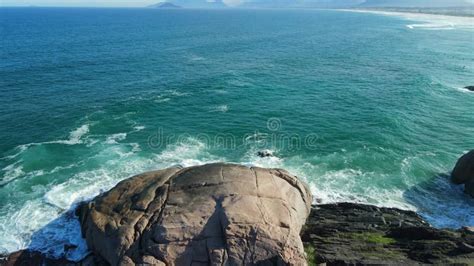 Joaquina Beach With Mountains Rocks And Ocean With Waves In Brazil