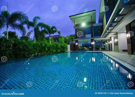 Modern House with Swimming Pool at Night Stock Image - Image of property, home: 40351241