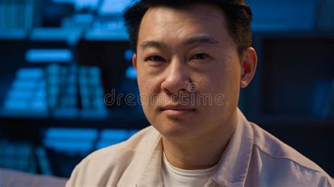 Smiling Happy Asian Man At Dark Night Evening Home Office With