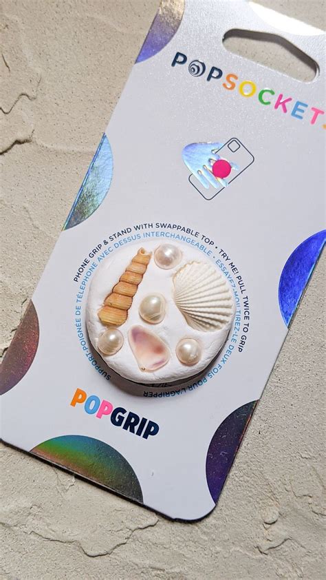 There Is A Card With An Image Of Shells On It And The Words Popgrip