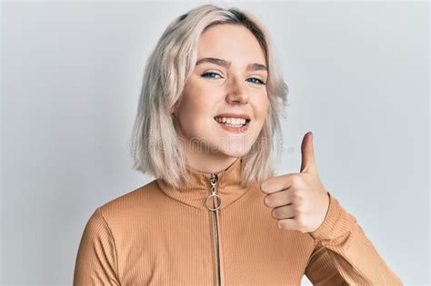 Young Blonde Girl Wearing Casual Clothes Doing Happy Thumbs Up Gesture