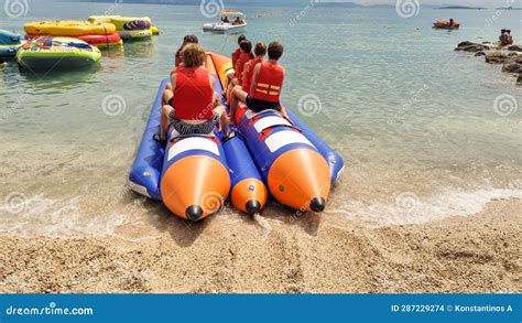 water sports   sea banana boat fun   group  young tourists