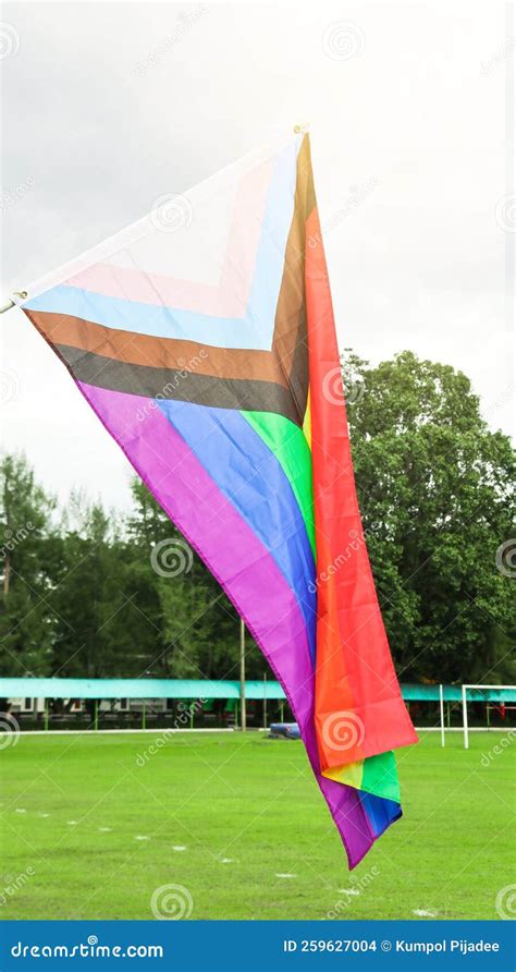 LGBT Rainbow Flag Waving with Blue Sky in Background To Enhance LGBTQ+ ...