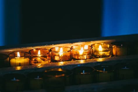 Candles Lit in Prayer in a Church Stock Image - Image of yellow ...