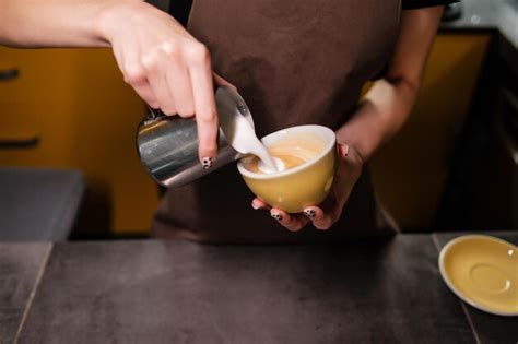 Premium Photo Coffee Making Process Barista Pouring Warm Milk Into