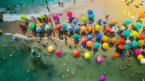 Vibrant Beach Scene With Colorful Umbrellas And Sunbathers From Above