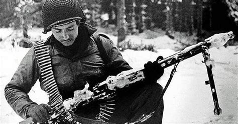 An American Gi Tony Vaccaro Posing With A Captured German Mg 42 Machine Gun Ardennes Belgium