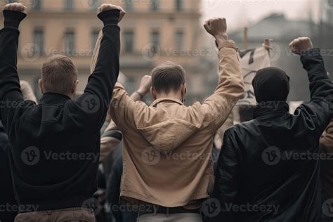 Back view of aggressive people protesting at city street. Protest ...