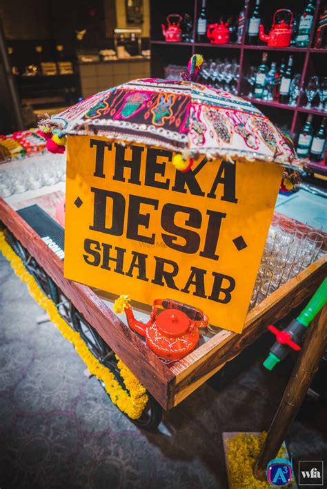 Photo Of Bar Desi Theka Board With Kettle And Umbrella