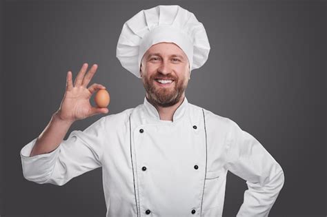 Premium Photo Smiling Chef In White Uniform