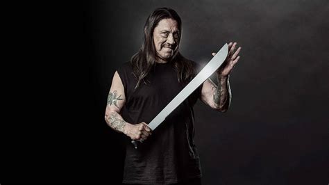 Download Danny Trejo With Silver Machete Wallpaper