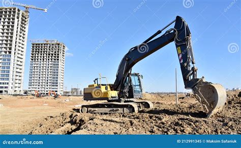 Excavator On Earthworks At Construction Site Backhoe On Foundation