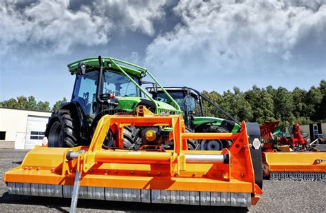 Farming tractor and mower stock image. Image of industry - 81963869