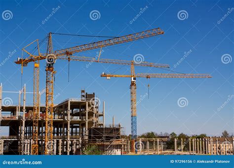 Construction Tower Cranes And High Rise Building Under Construction