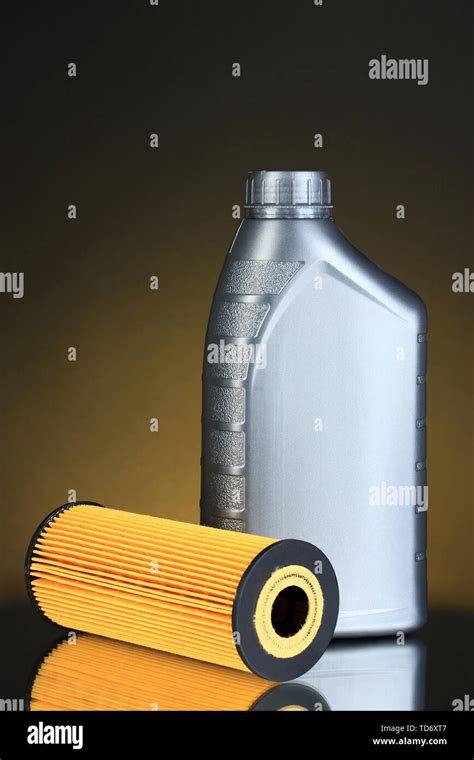 Car oil filter and motor oil can on dark color background Stock Photo - Alamy