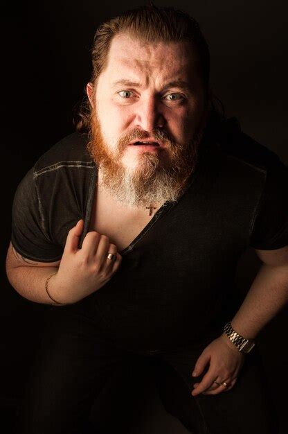 Premium Photo Portrait Of Man Standing Against Black Background