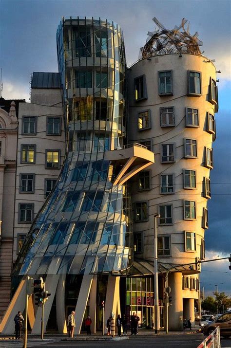 A Very Tall Building Sitting Next To A Traffic Light In Front Of A