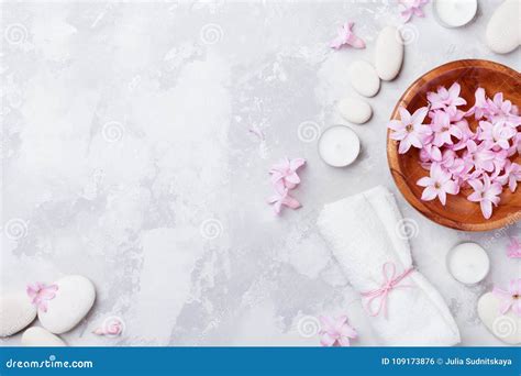 Aromatherapy Beauty Spa Background With Massage Pebble Perfumed Flowers Water And Candles On