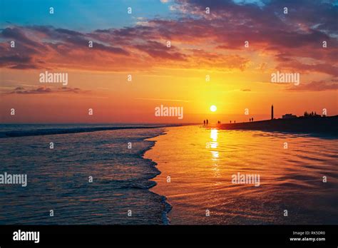 sunset on beach maspalomas gran canaria Stock Photo - Alamy