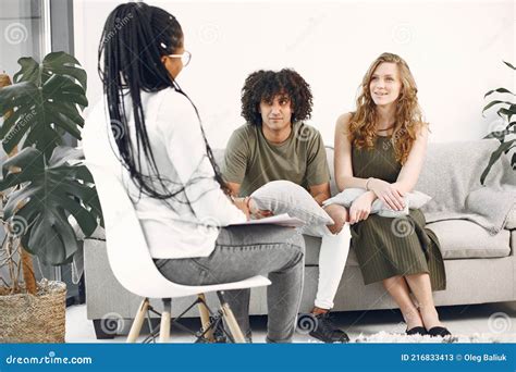 Couple Having Conversation With Psychologist On Therapy Stock Image