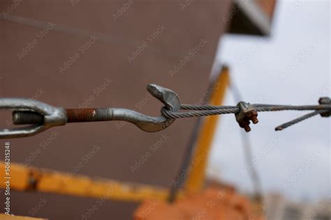 Tensioned Cable On The Hook Building Clamps And Tensioning Cables