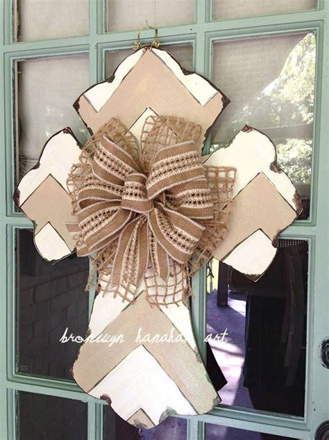 A Decorative Door Hanger With A Bow On It S Front Door In The Shape Of