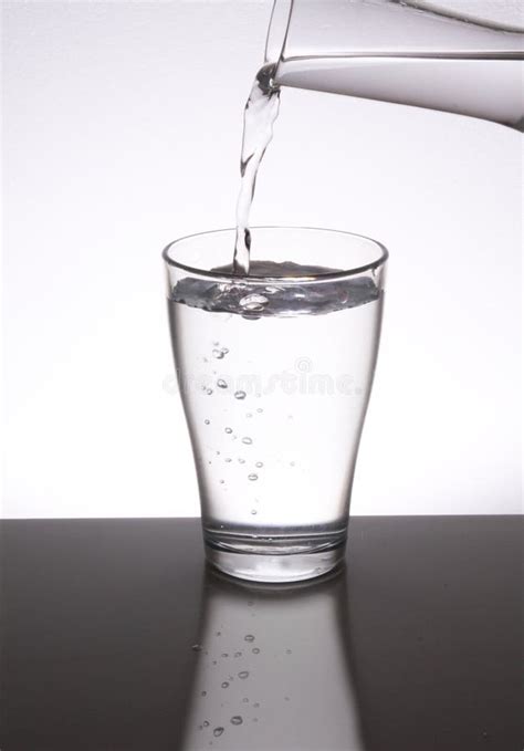 Filling a glass with water stock photo. Image of glass - 18078624