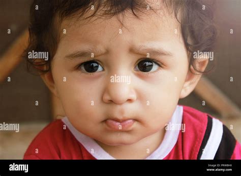 Closeup Up Portrait Headshot Suspicious Cautious Child Boy Looking At