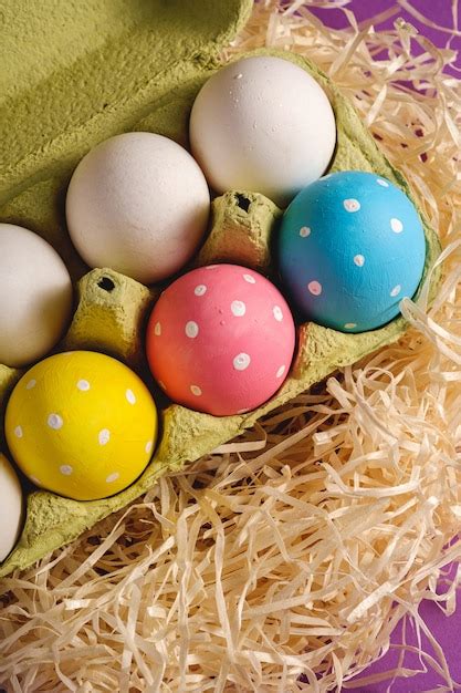 Premium Photo Colorful Polka Dot Easter Eggs In Egg Tray On Wooden