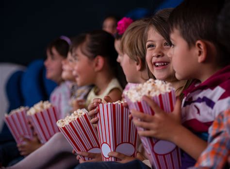 Group Of Kids At The Cinema Stock Photo - Download Image Now - Movie Theater, Child, Movie - iStock