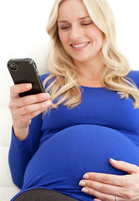 Pregnant Woman Using A Mobile Phone By Ian Hooton Science Photo Library