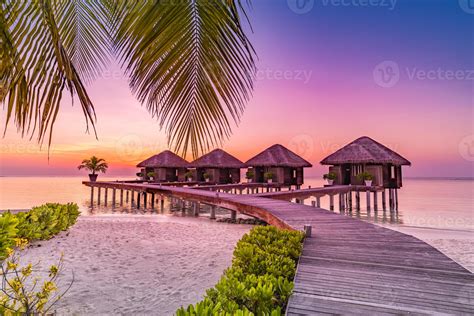 Maldives island sunset. Water bungalows resort at islands beach. Indian ...