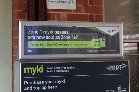 'Zone 1 myki passes are now sold as Zone 1+2' sign above a Myki machine - Wongm's Rail Gallery